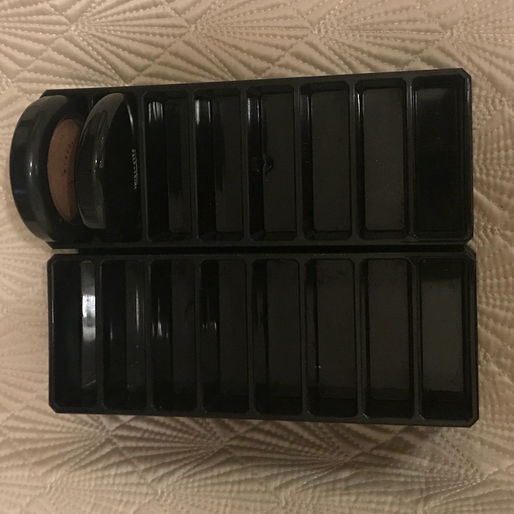 Two black acrylic makeup blush foundation holders